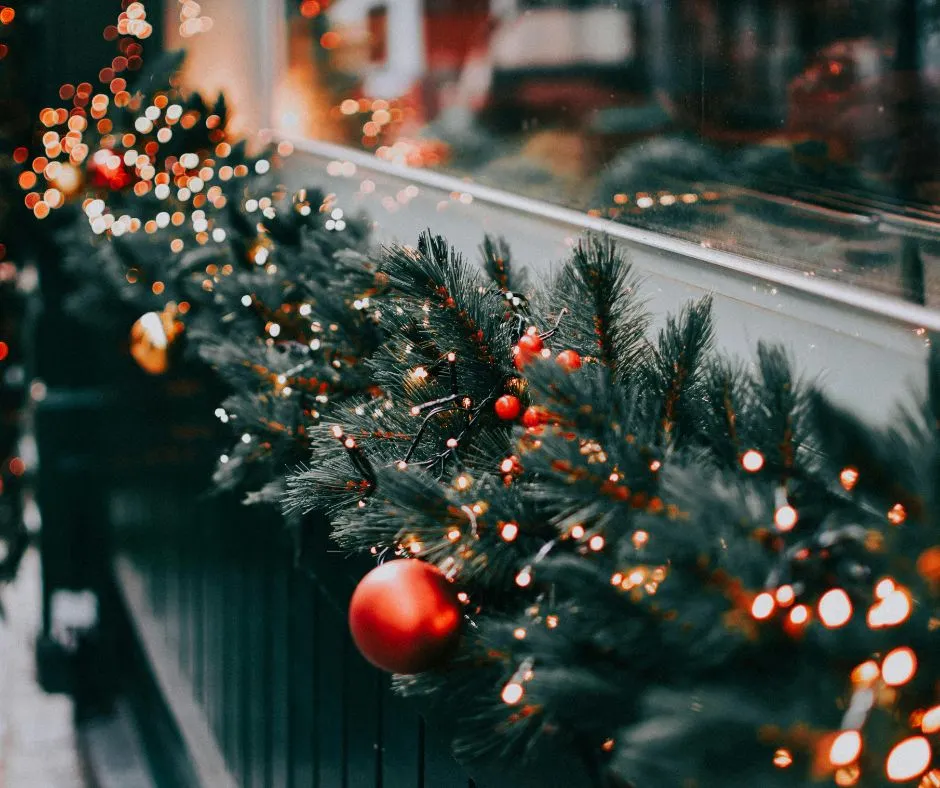 Christmas decor image 1 Christmas garland with lights on a windowsill.